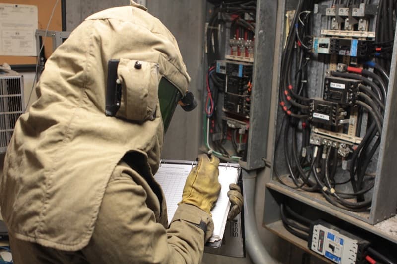 Technician in arc-rated PPE during NFPA 70E training